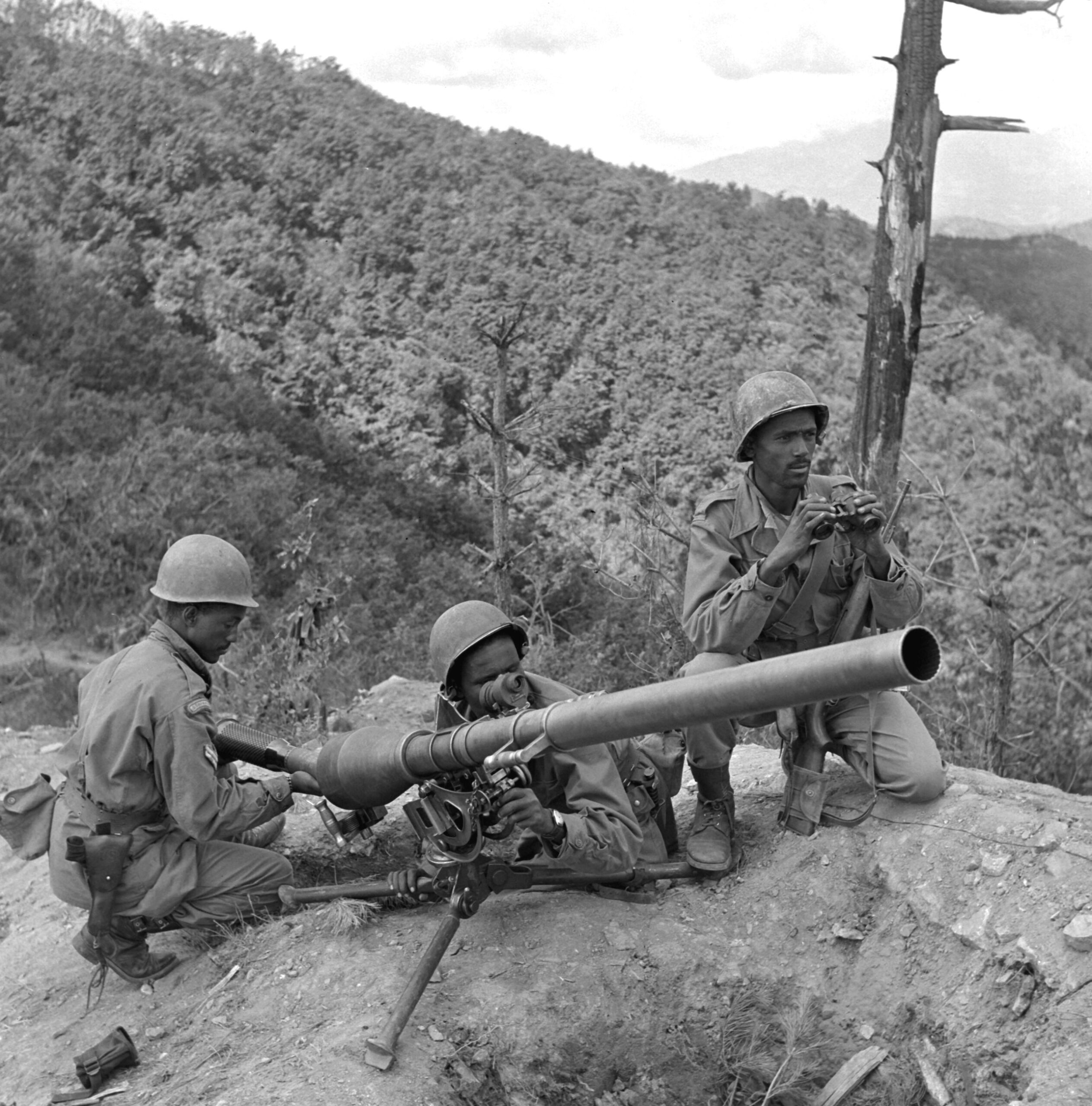 Ethiopian Kagnew Battalion soldiers with a recoilless rifle on a Korean hillside in 1951